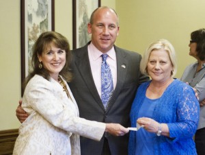 Dr. Sam Pierce, American Optometric Association presenting check to Camp Courage