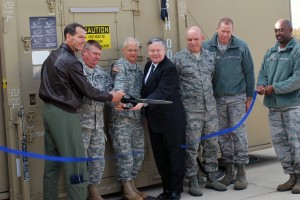 Air Force Lt. Gen. Sid Clarke, left, joins with officials from the Alabama National Guard in cutting the ribbon on the new Next Generation Data Acquisition Segment at the Alabama Air National Guard’s Eagle Vision 6 site at Redstone Arsenal, Ala. The new equipment allows for faster acquisition of unclassified satellite imagery to aid in the response to natural and manmade disasters as well as to provide worldwide support to contingency operations. (Courtesy photo by Alabama National Guard) 