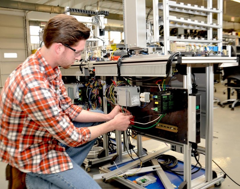 NW-SCC student, Tyler Scott works to rewire a Modular Mecatronics System DS3 Automation Trainer as part of a class project which he serves as the programmer and team leader.