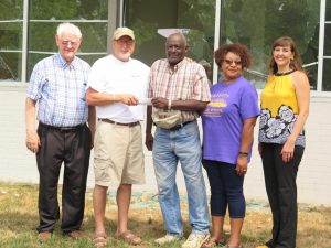  Cars and Bikes on The Square: Tom Schuman with Cars and Bikes on The Square donates $2,000 to ALCA Members Richard Martin, Edward Gilbert, Carolyn Williams and Rebekah Davis