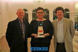Athens Arts League Executive Committee member Amy Golden accepts the Excellence in Fundraising award from Charles Goodrich, Main Street Alabama Board Chairman and Vice President of Revitalization Programs for the National Main Street Center, Matt Wagner.