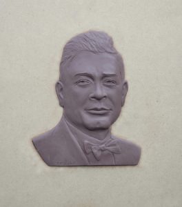 (Plaque reads) In 1928, Oscar S. DePriest, son of former slaves, became the first 20th century African-American Congressman from the north. He is credited with the Anti-discrimination Amendment to the 1933 Civilian Conservation Corps Bill.