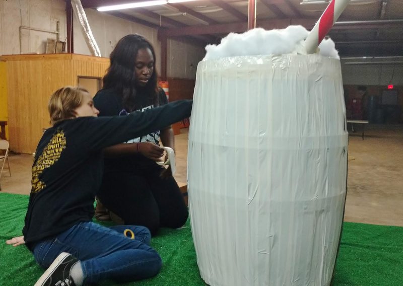 Athens Mayor's Youth Commissioners Daphne Embry and Raven Warner working on the Youth Commission's float entry. The float contest is highly competitive with many of the entrants hiding their floats in undisclosed locations throughout Athens so that no one will see them until the parade.